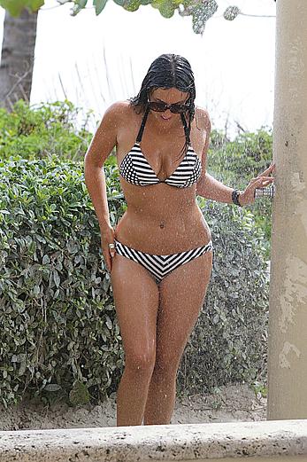 Claudia Romani taking a shower in a bikini in Miami