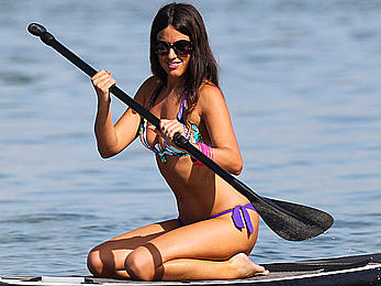 Claudia Romani paddleboarding in sexy bikini in miami