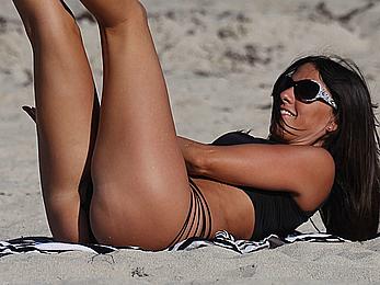 Claudia Romani wearing black swimsuit in Miami