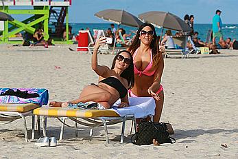 Claudia Romani and Elisa Scheffler in bikini at Miami beach