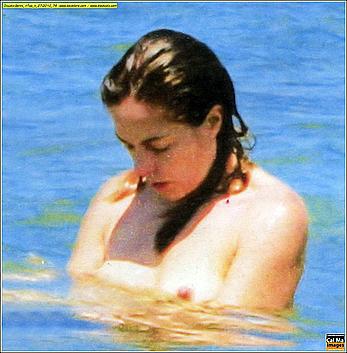 Italian actress and showgirl Claudia Gerini topless in a sea