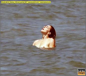 Italian actress and showgirl Claudia Gerini topless in a sea