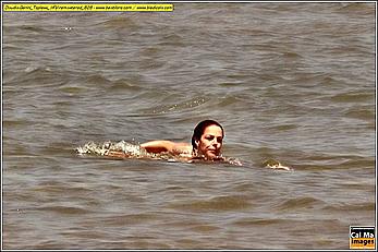 Italian actress and showgirl Claudia Gerini topless in a sea