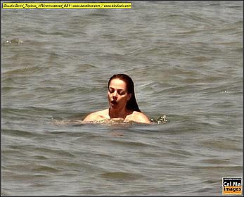 Italian actress and showgirl Claudia Gerini topless in a sea