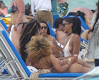 Claudia Jordan tit slip and see through in wet swimsuit