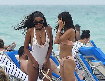 Claudia Jordan tit slip and see through in wet swimsuit