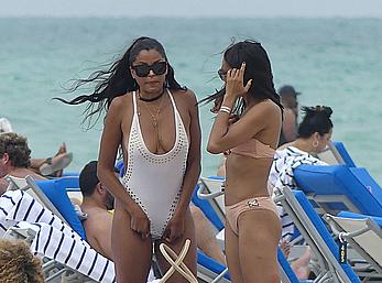 Claudia Jordan tit slip and see through in wet swimsuit