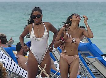 Claudia Jordan tit slip and see through in wet swimsuit