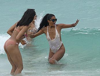 Claudia Jordan tit slip and see through in wet swimsuit