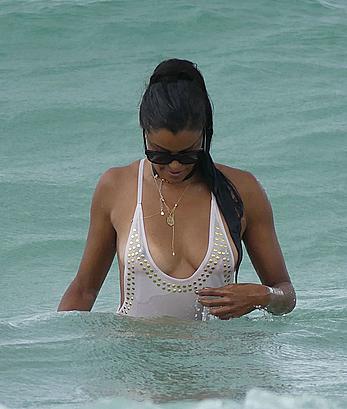 Claudia Jordan tit slip and see through in wet swimsuit