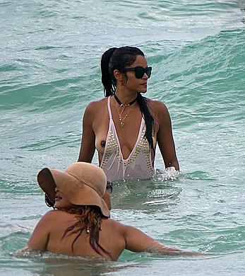 Claudia Jordan tit slip and see through in wet swimsuit