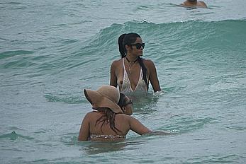 Claudia Jordan tit slip and see through in wet swimsuit