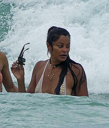 Claudia Jordan tit slip and see through in wet swimsuit