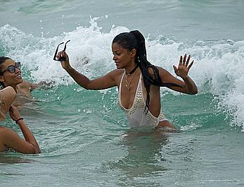 Claudia Jordan tit slip and see through in wet swimsuit