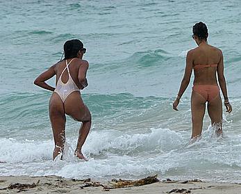 Claudia Jordan tit slip and see through in wet swimsuit