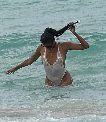 Claudia Jordan tit slip and see through in wet swimsuit