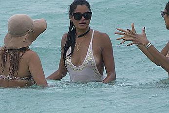 Claudia Jordan tit slip and see through in wet swimsuit