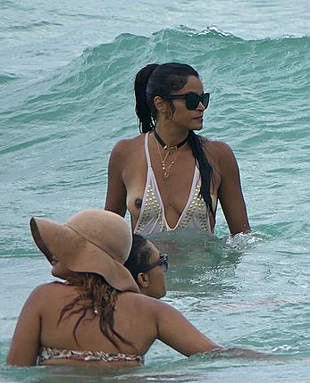 Claudia Jordan tit slip and see through in wet swimsuit