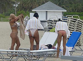 Claudia Jordan tit slip and see through in wet swimsuit