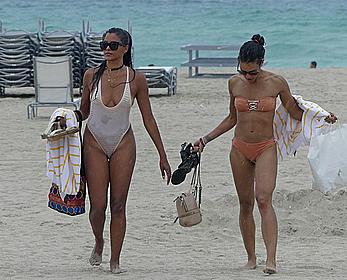 Claudia Jordan tit slip and see through in wet swimsuit