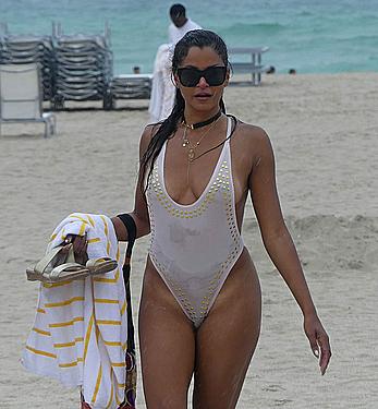 Claudia Jordan tit slip and see through in wet swimsuit