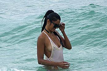 Claudia Jordan tit slip and see through in wet swimsuit