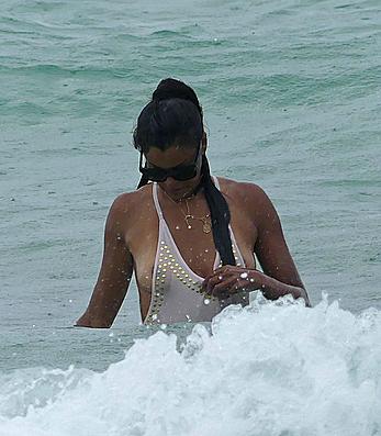 Claudia Jordan tit slip and see through in wet swimsuit