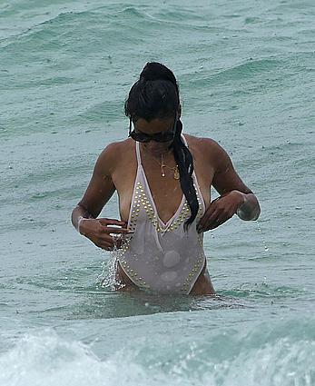 Claudia Jordan tit slip and see through in wet swimsuit