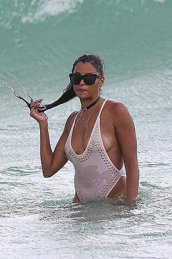 Claudia Jordan tit slip and see through in wet swimsuit