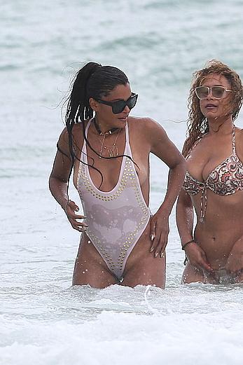 Claudia Jordan tit slip and see through in wet swimsuit