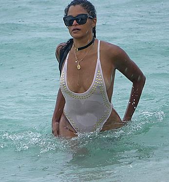 Claudia Jordan tit slip and see through in wet swimsuit