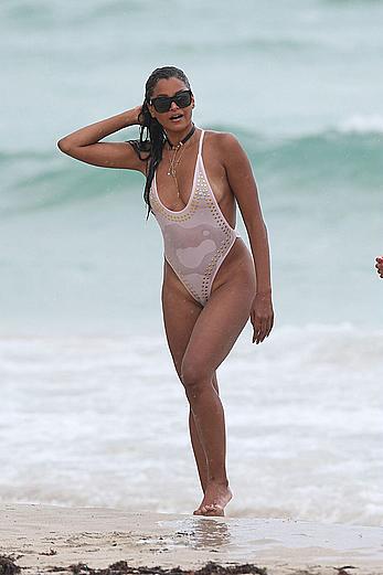 Claudia Jordan tit slip and see through in wet swimsuit