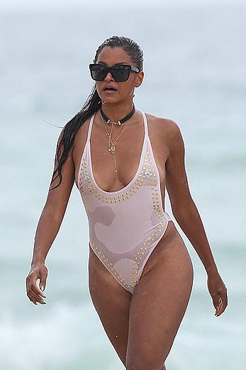 Claudia Jordan tit slip and see through in wet swimsuit