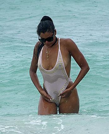 Claudia Jordan tit slip and see through in wet swimsuit