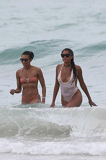 Claudia Jordan tit slip and see through in wet swimsuit