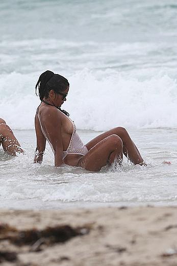 Claudia Jordan tit slip and see through in wet swimsuit