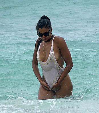 Claudia Jordan tit slip and see through in wet swimsuit