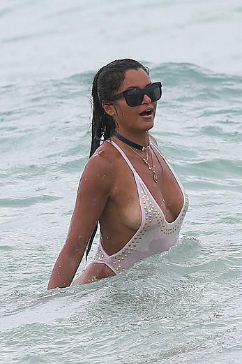 Claudia Jordan tit slip and see through in wet swimsuit