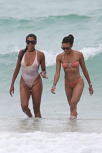 Claudia Jordan tit slip and see through in wet swimsuit