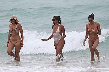 Claudia Jordan tit slip and see through in wet swimsuit