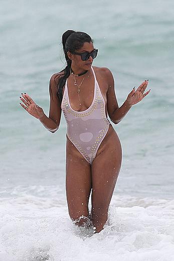 Claudia Jordan tit slip and see through in wet swimsuit