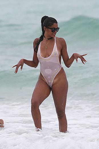 Claudia Jordan tit slip and see through in wet swimsuit