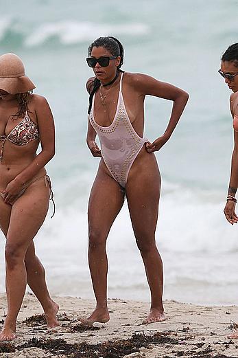 Claudia Jordan tit slip and see through in wet swimsuit