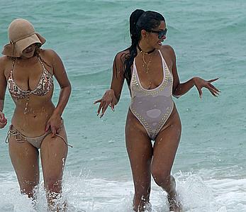 Claudia Jordan tit slip and see through in wet swimsuit