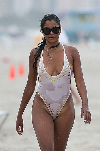 Claudia Jordan tit slip and see through in wet swimsuit