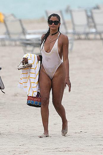 Claudia Jordan tit slip and see through in wet swimsuit