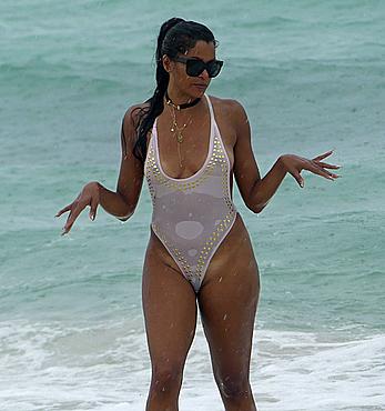 Claudia Jordan tit slip and see through in wet swimsuit