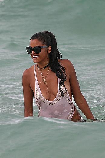 Claudia Jordan tit slip and see through in wet swimsuit