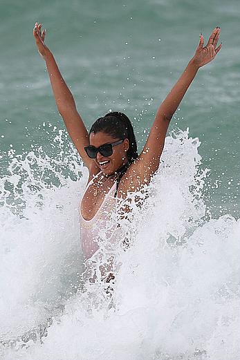 Claudia Jordan tit slip and see through in wet swimsuit