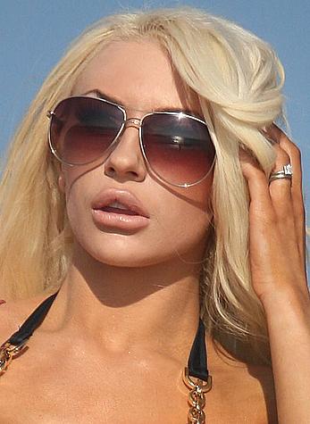 Busty Courtney Stodden enjoys a day at the beach in Southern California, shows deep cleavage